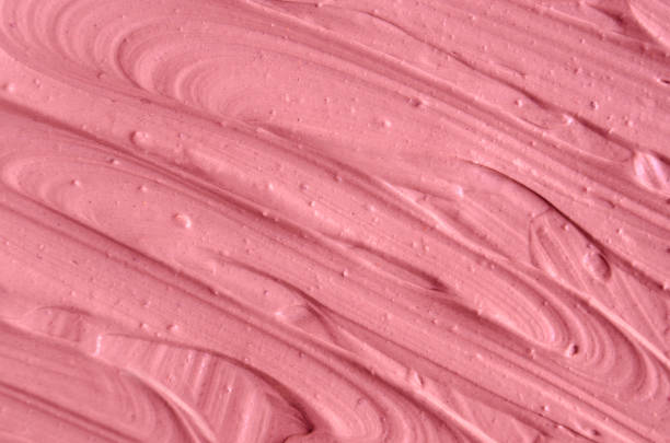 istock Pink cosmetic clay (facial mask, cream) texture close up, selective focus. Abstract background 664637788