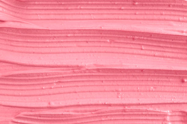 istock Pink cosmetic clay (facial mask, cream) texture close up, selective focus. Abstract background 664638094