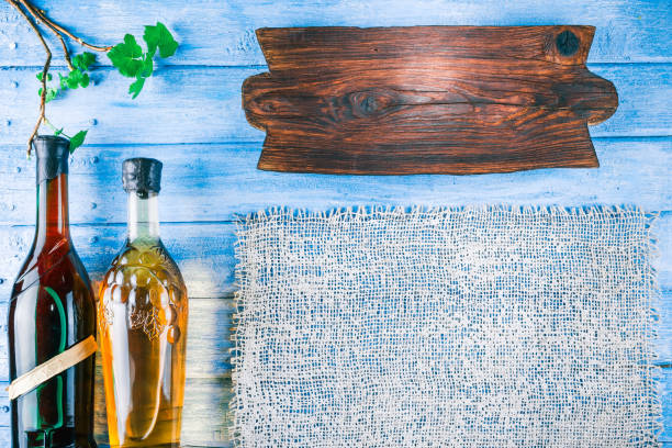istock Blue wood background with wine theme 664639024