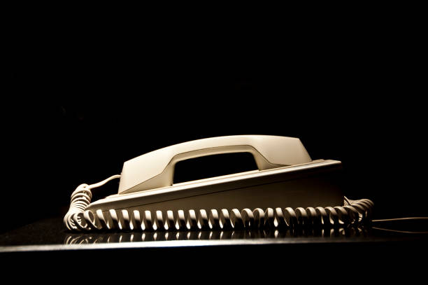 Telephone with digital display on wooden desk