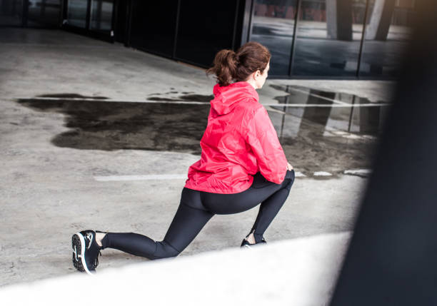 istock Female Athlete Warming up Outdoors 664646574