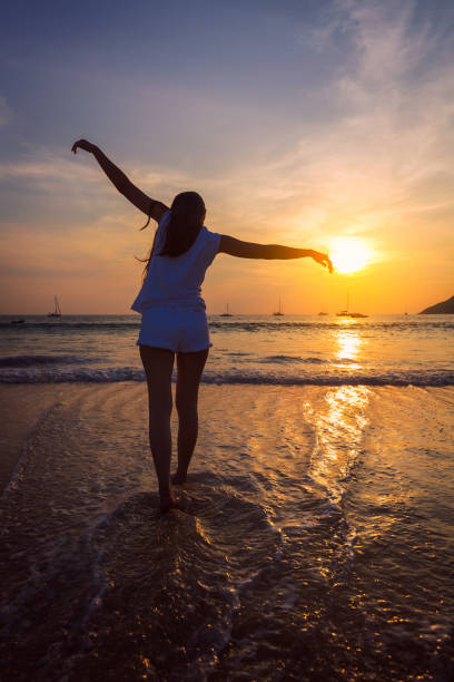 istock Young asia woman on beach 664650078