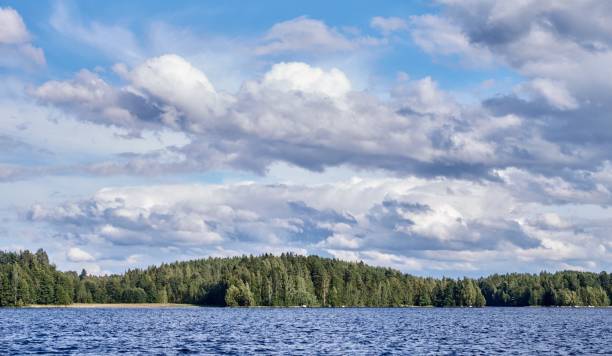 istock Dramatic cumulus clouds in the bright summer day scene in Finland 664652738