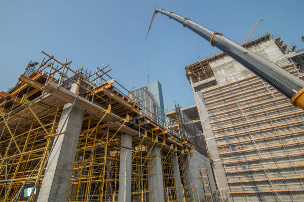 Building with Cranes. Construction cranes over Al Maryah Island in Abu Dhabi stock photo