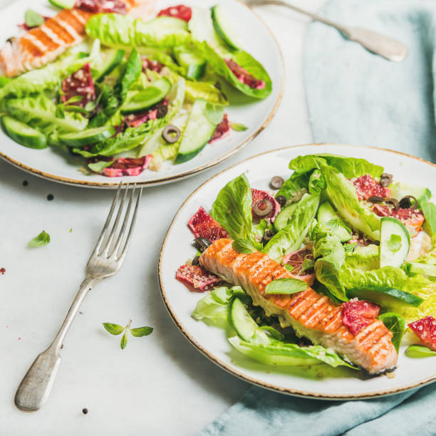 istock Healthy spring salad with grilled salmon, orange and quinoa 664656736