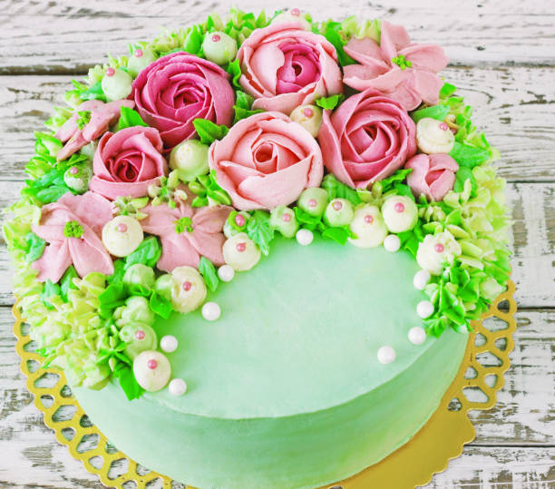 istock Birthday cake with flowers rose on white background 664660438