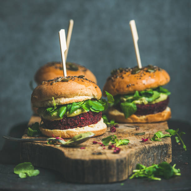 istock Healthy vegan burger with beetroot-quinoa patty and arugula, square crop 664661442
