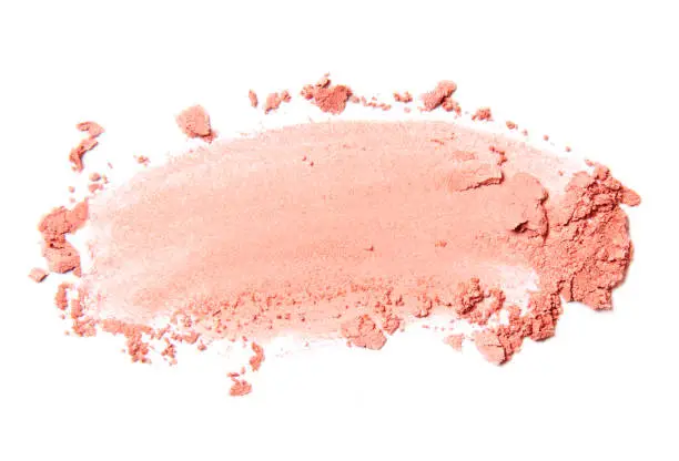 pink crumbled and scattered blush and eyeshadow brush stroke isolated on white background