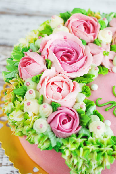 istock Birthday cake with flowers rose on white background 664663842