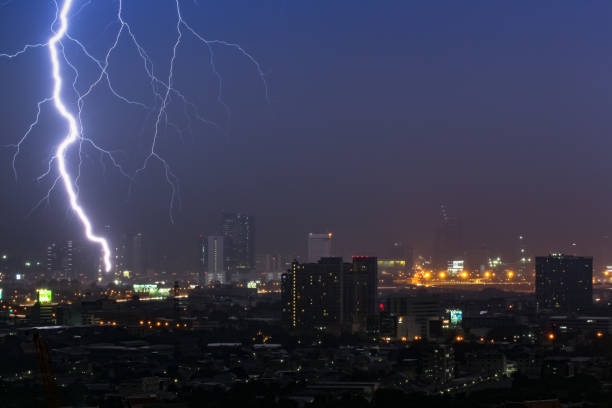 istock Dramatic thunder storm lightning bolt on the horizontal sky and city scape 664664000