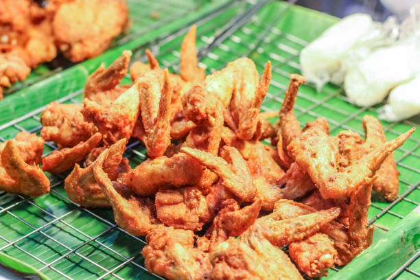 istock Delicious fried chicken meat with sticky rice, Thai food 664664040