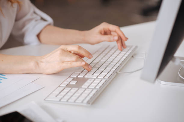 istock Hardworking young manager typing in the office 664664702