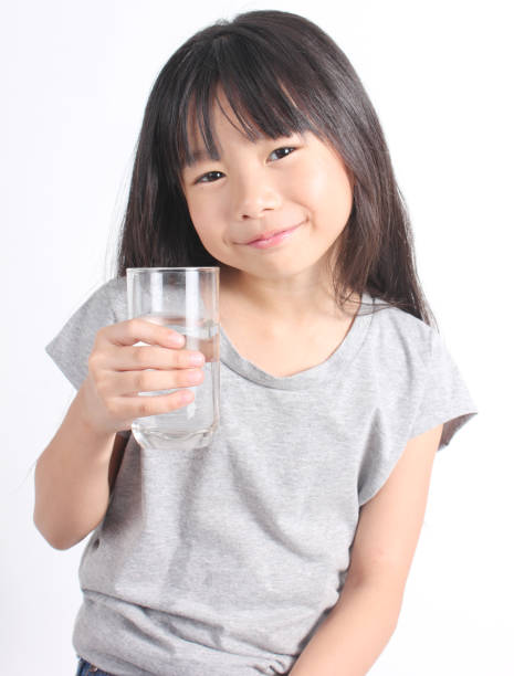 istock Young little girl drinking water 664667178