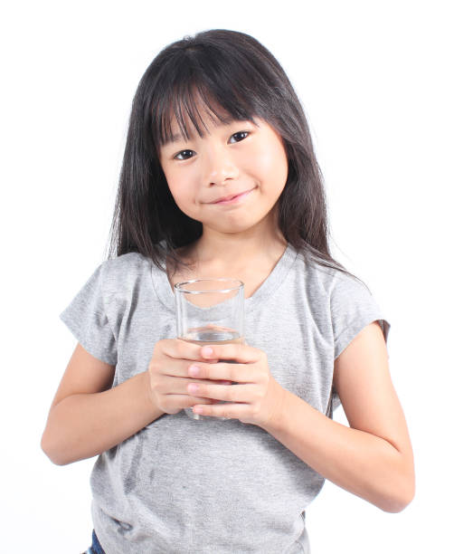 istock Young little girl drinking water 664667180