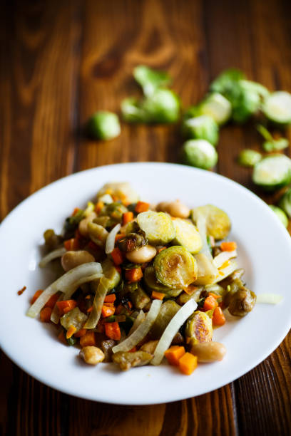 istock Brussels sprouts roasted with vegetables and beans 664668674