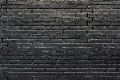 Black brick texture wall for background. Painted bricks