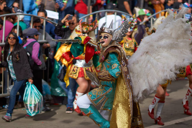 Oruro, Bolivia - February 25, 2017: Masked Diablada dancers from the group La Diablada, performing in Avenida Adolfo Mier, at the annual Oruro Carnival in Bolivia. The event has been classified by UNESCO as being of Intangible Cultural Heritage of Humanity and attracts around 30,000 dancers and musicians.