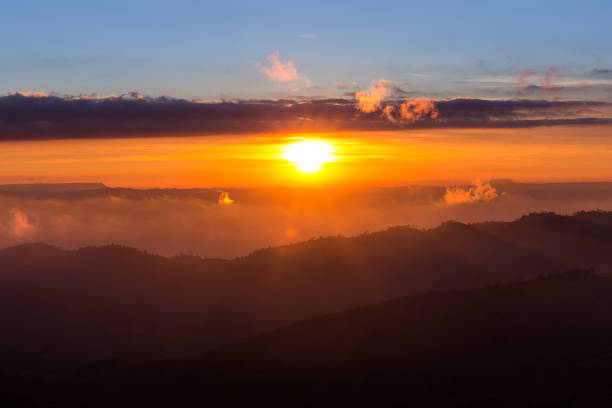 istock sunrise on multi layer of high mountain in with haze, Thailand 664673658