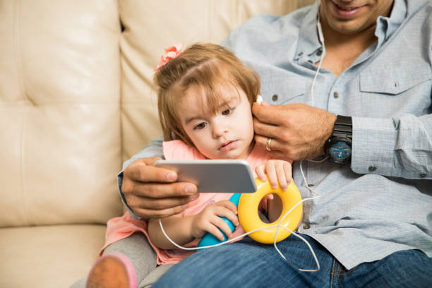 istock Giirl answering a video call with her father 664673904