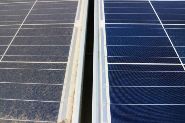 Dirty versus Clean Photovoltaic Panels stock photo