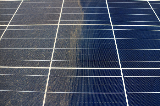 Partially Clean Photovoltaic Panels Showing the difference of Clean and Unclean Surface