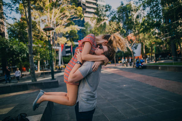 Happy young couple embracing in Melbourne Southbank.