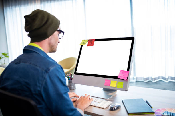 istock Side view of casual man working at computer desk 664688916