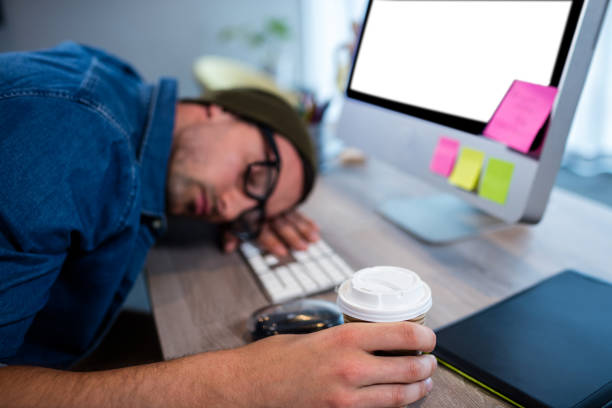 istock Hipster businessman sleeping at his desk 664692152