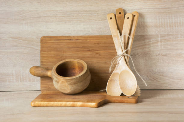 istock Wooden rustic and vintage crockery, tableware, utensils and stuff on wooden table-top. Kitchen still life as background for design. Image with copy space. 664699782