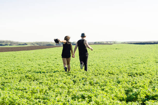 istock man and woman in a meadow 664703318