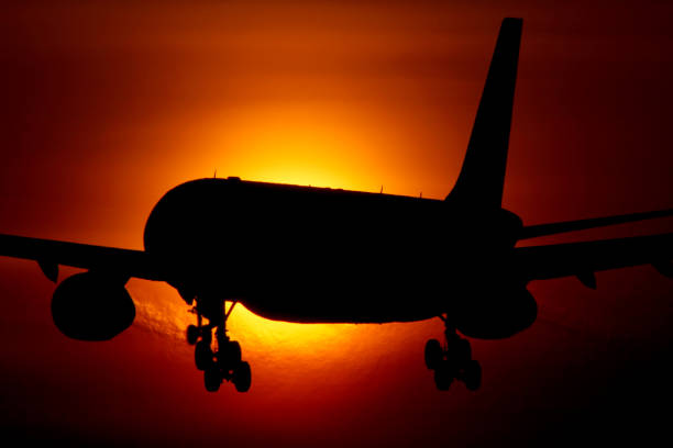 Airbus A330 passenger airplane crossing the sun.