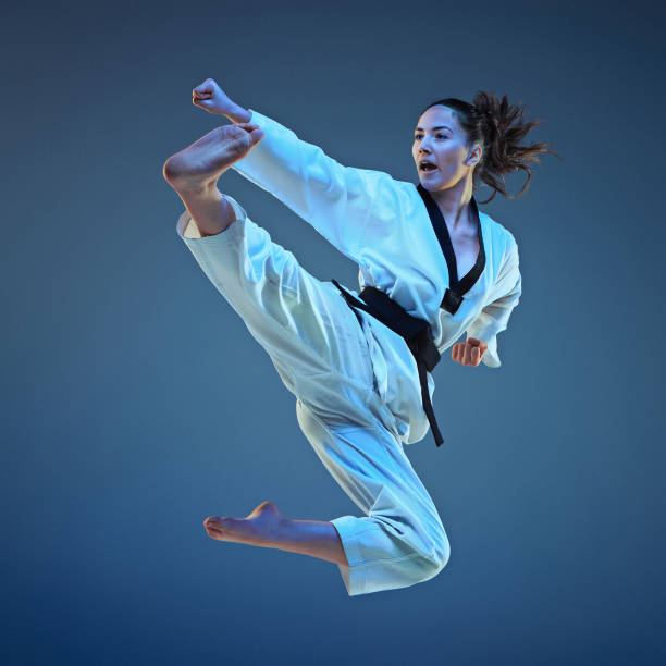 the karate girl with black belt - boxing combative sport defending protection imagens e fotografias de stock