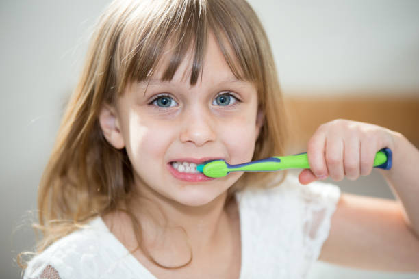 istock Little girl brushing teeth 664707668