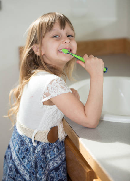 istock Little girl brushing teeth 664707832