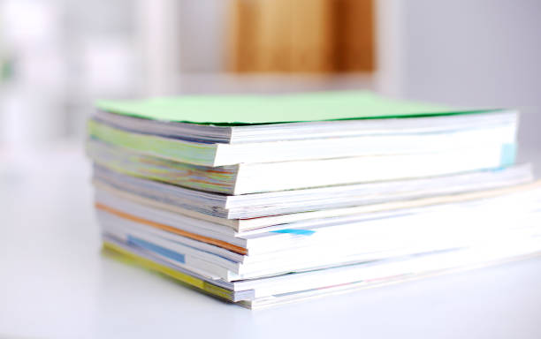 istock Group of multicolored office folders and glasses 664708058
