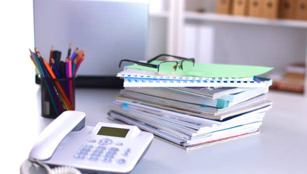 istock Group of multicolored office folders and glasses 664708554