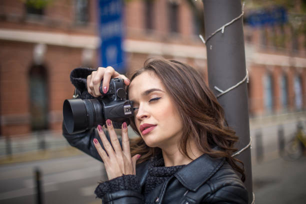 istock Charming girl photographer 664709764