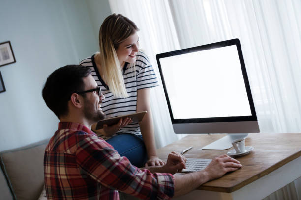 istock Couple working together on startup project from home 664712096