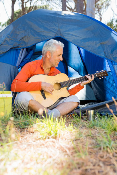 istock Mature man playing guitar 664712484