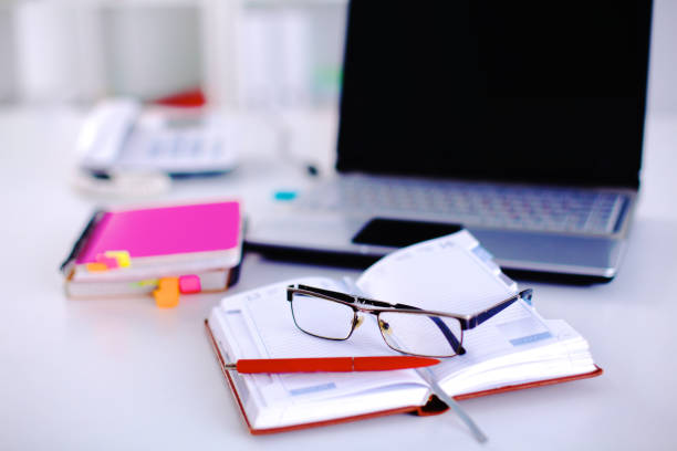 istock Group of multicolored office folders and glasses 664712768