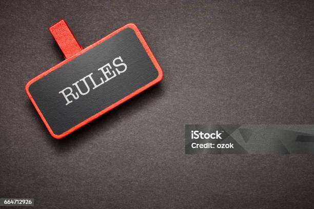 Red Label On The Chalkboard Stock Photo - Download Image Now - Rules, Following - Moving Activity, Law