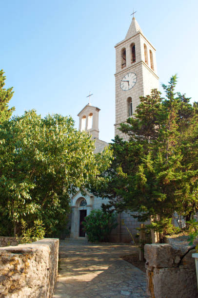 istock Entrance to a white stone church tower 664715762