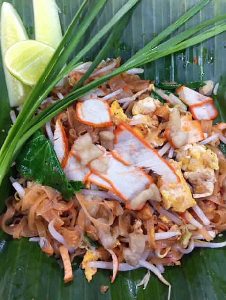 istock Fried thai noodle mixed with vegetables, pork, tofu, and eggs 664719416