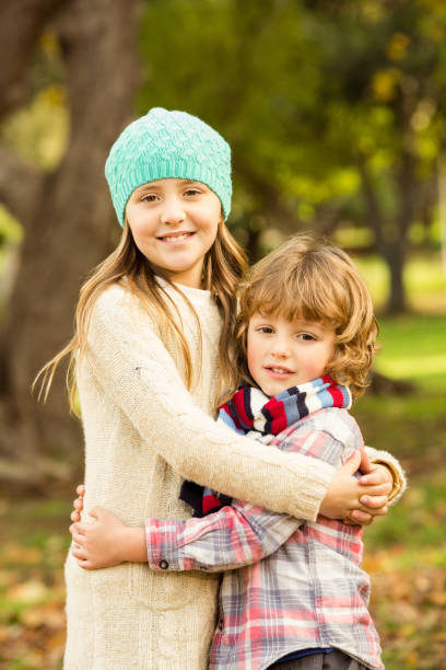 istock Happy siblings in the park 664720110