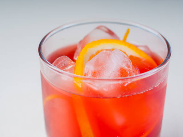 istock Colorful bright cocktail decorated with ice, sugar and fruit. Cooling drink 664722328