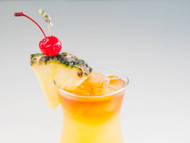 istock Colorful bright cocktail decorated with ice, sugar and pineapple. Cooling drink 664722440