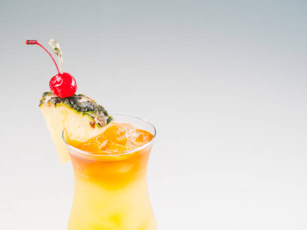 istock Colorful bright cocktail decorated with ice, sugar and pineapple. Cooling drink 664722532