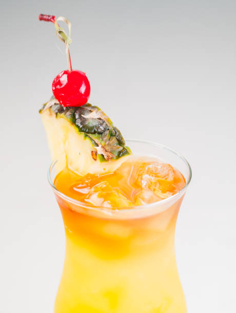 istock Colorful bright cocktail pina colada decorated with ice, sugar and fruit. Cooling drink 664722576