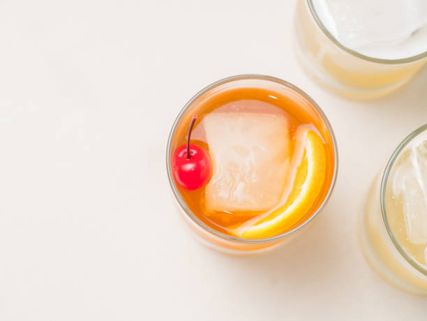 istock Colorful bright cocktail decorated with ice, sugar and fruit. Cooling drink. View from above 664722760
