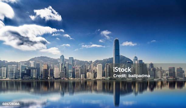 Panorama Of Hong Kong Island With Reflections In The Water Stock Photo - Download Image Now